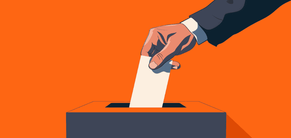 Man inserting ballot into ballot box